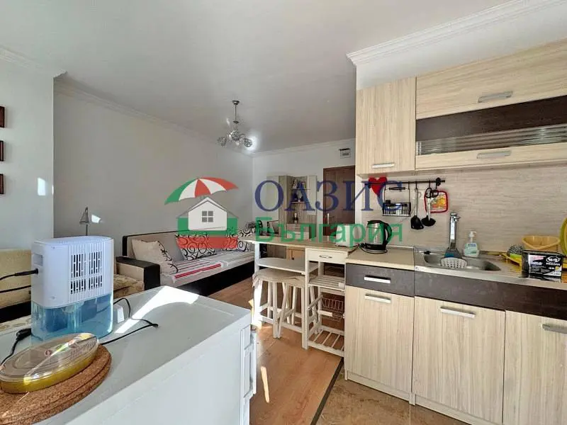 Kitchen; kitchen appliances, tile floor, natural light