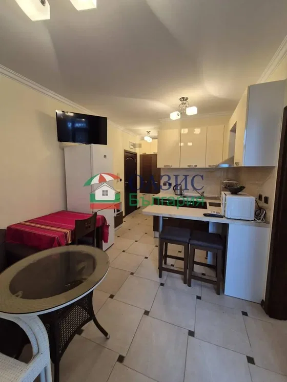 Kitchen; tile floor, kitchen appliances, natural light