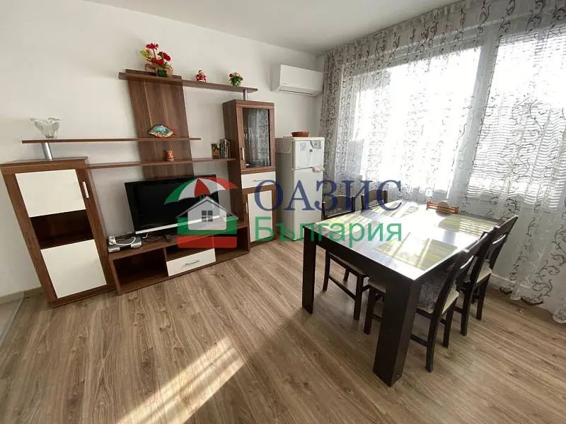 Kitchen; kitchen appliances, natural light, tile floor