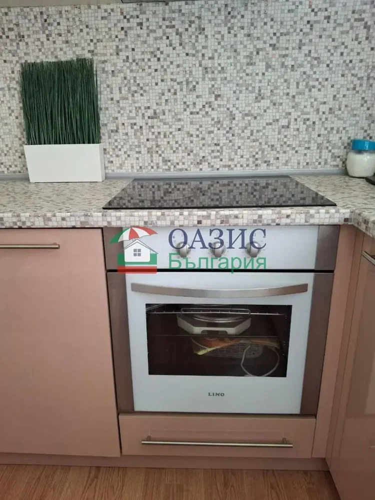 Kitchen; kitchen appliances, wood floor, renovated, natural light