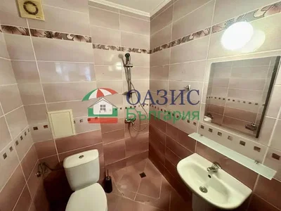 Toilet; tile floor, needs renovation