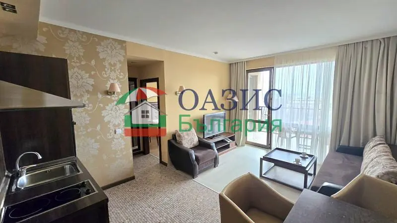 Living room; kitchen appliances, natural light