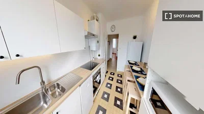 Kitchen; kitchen appliances, tile floor, natural light