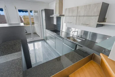Kitchen; kitchen appliances, tile floor, natural light
