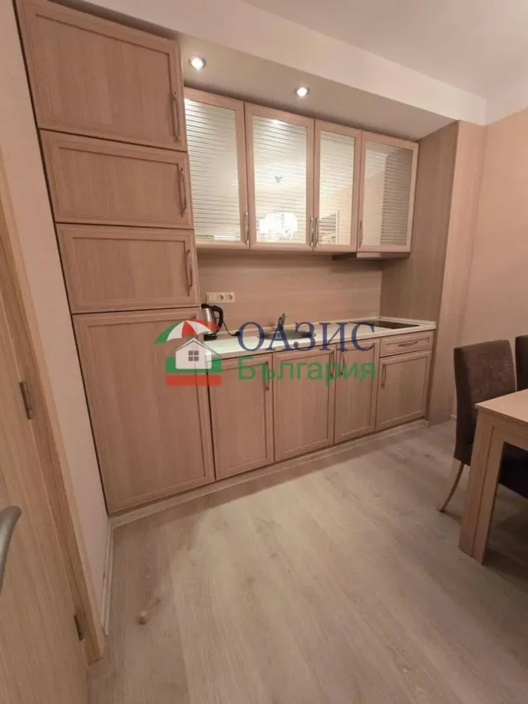 Kitchen; kitchen appliances, wood floor, renovated, natural light