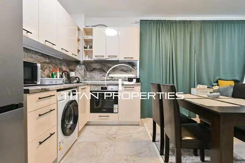 Kitchen; kitchen appliances, tile floor, natural light