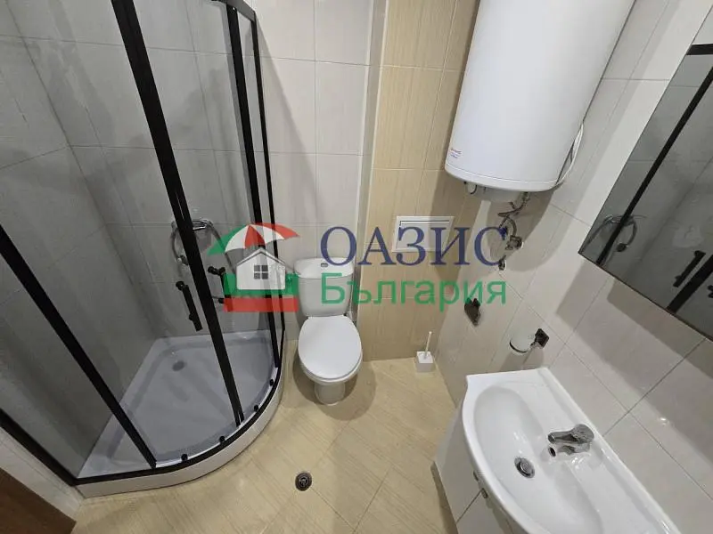 Toilet; tile floor, natural light
