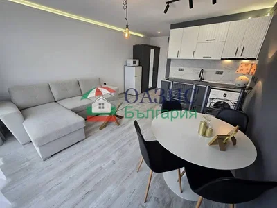 Living room; wood floor, tile floor, natural light, modern style, kitchen appliances