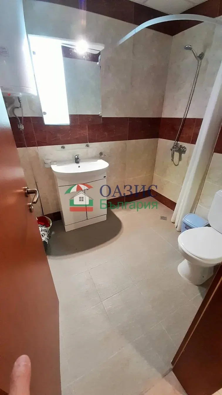 Toilet; tile floor, natural light