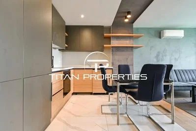 Kitchen; kitchen appliances, wood floor, tile floor, renovated, natural light, modern style