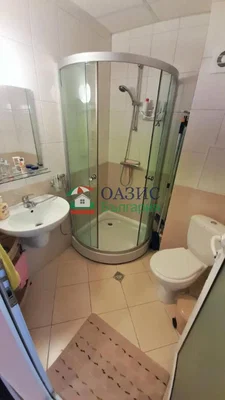 Toilet; tile floor, needs renovation