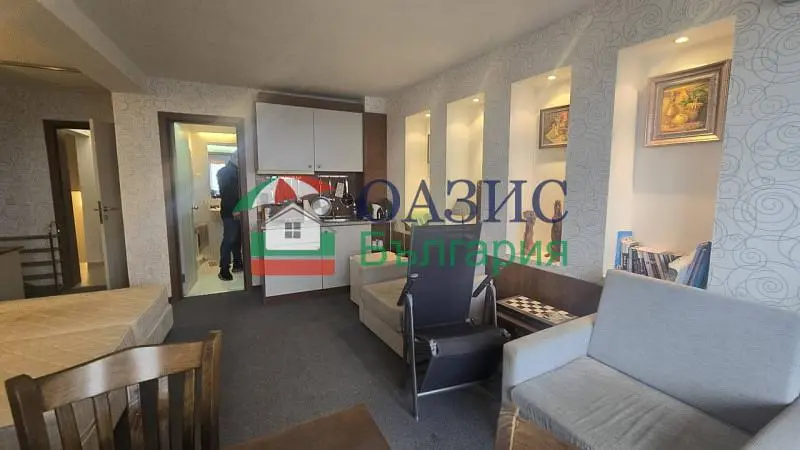 Living room; kitchen appliances, natural light