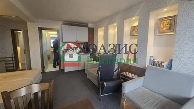 Living room; kitchen appliances, natural light