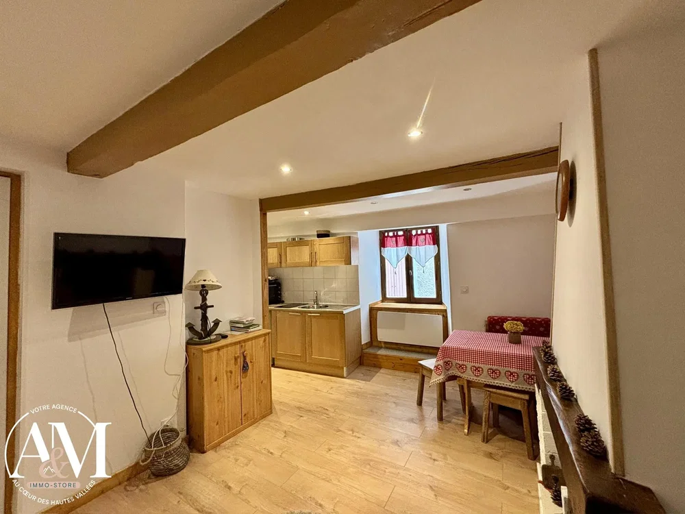 Living room; wood floor, wood beams, natural light, rustic style
