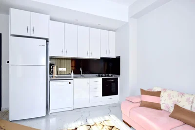 Kitchen; kitchen appliances, tile floor, natural light