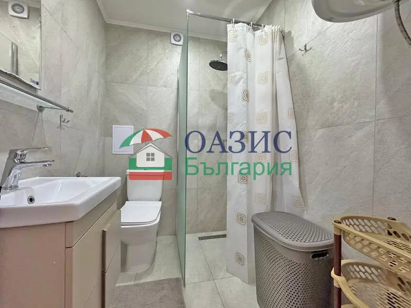 Toilet; tile floor, renovated, natural light