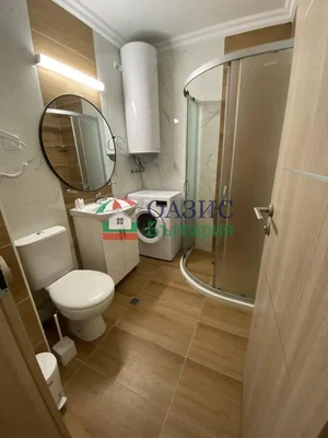 Toilet; tile floor, renovated, natural light