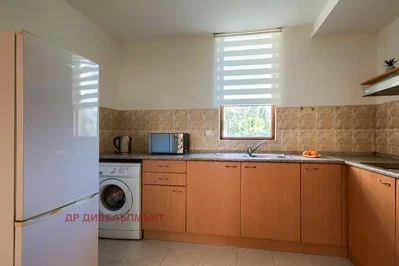 Kitchen; kitchen appliances, natural light, tile floor
