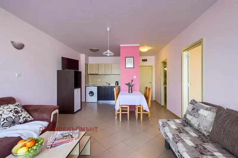 Living room; kitchen appliances, natural light, modern style
