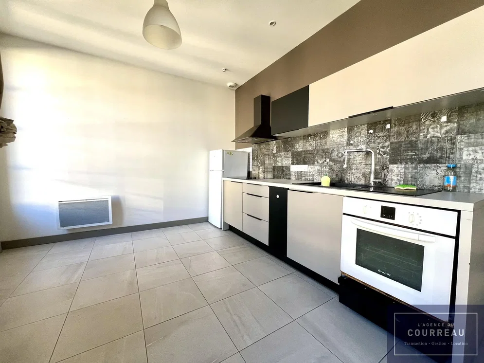 Kitchen; kitchen appliances, tile floor, natural light