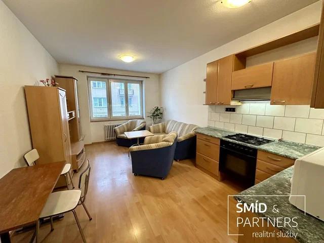 Living room; wood floor, natural light, kitchen appliances