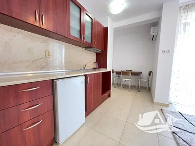 Kitchen; kitchen appliances, tile floor, natural light