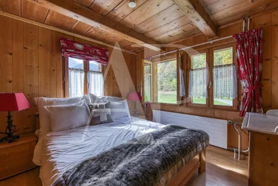 Bedroom; wood beams, wood floor, natural light