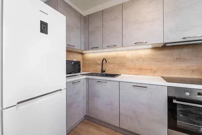 Kitchen; kitchen appliances, wood floor, renovated, natural light