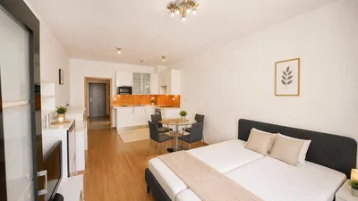 Dormitorio; suelo de madera, luz natural, estilo moderno