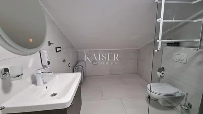 Toilet; tile floor, renovated, natural light
