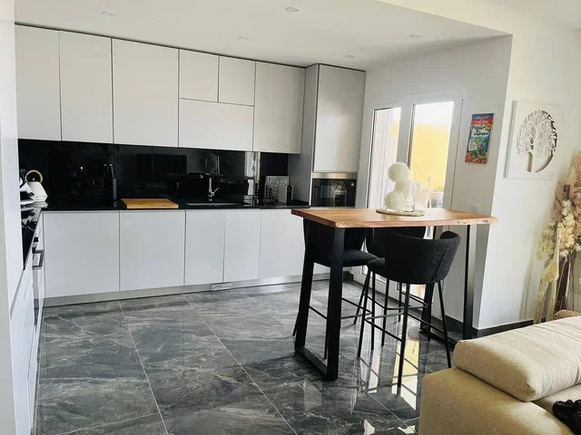 Kitchen; kitchen appliances, tile floor, natural light