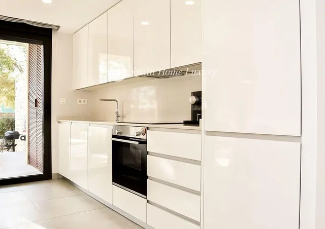 Kitchen; kitchen appliances, tile floor, natural light