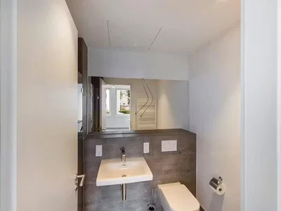 Toilet; tile floor, renovated, natural light