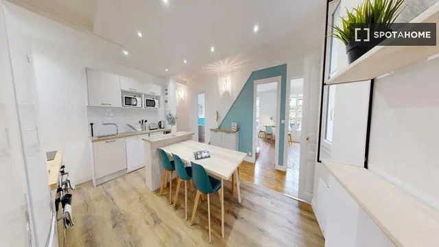 Kitchen; kitchen appliances, wood floor, natural light