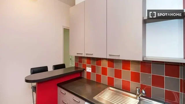 Kitchen; kitchen appliances, tile floor, natural light