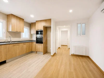 Kitchen; kitchen appliances, wood floor, natural light, renovated