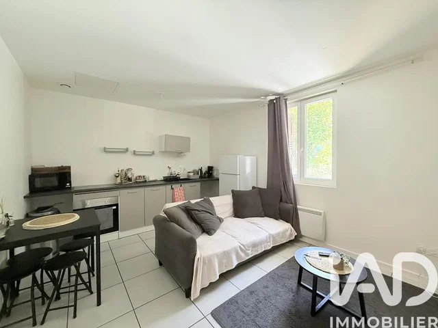 Living room; kitchen appliances, tile floor, natural light