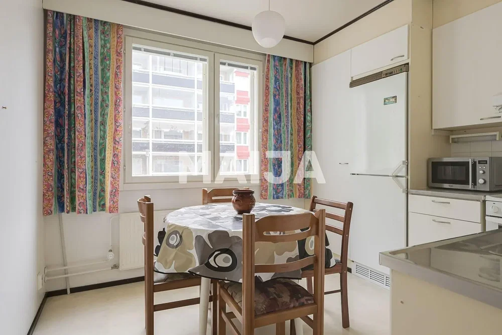 Kitchen; kitchen appliances, natural light, tile floor