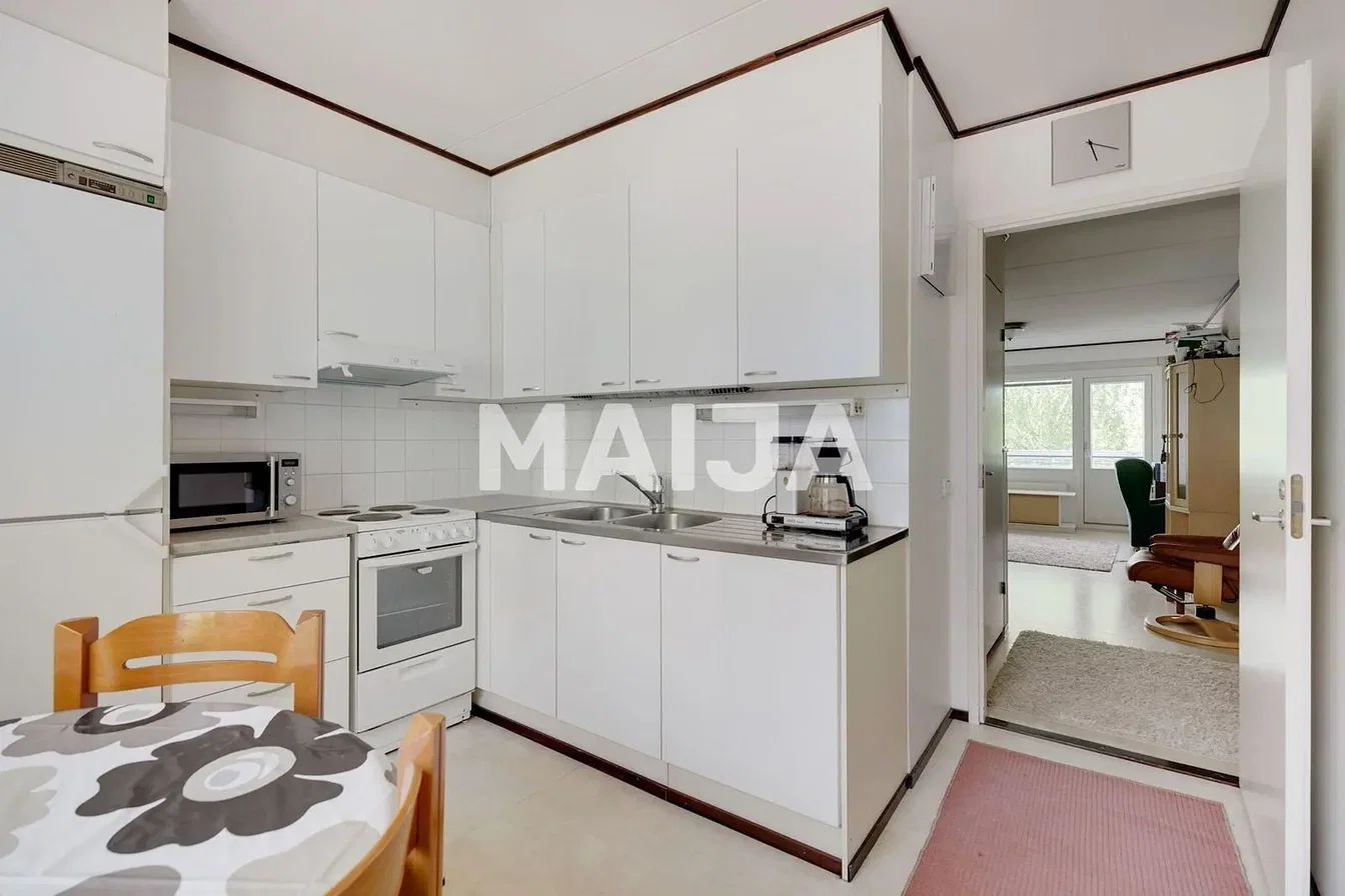Kitchen; kitchen appliances, tile floor, natural light