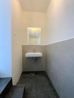 Toilet; tile floor, natural light