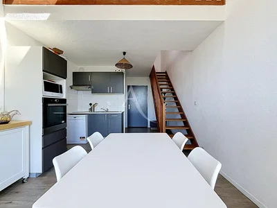 Kitchen; kitchen appliances, tile floor, natural light