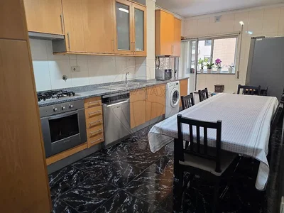 Kitchen; kitchen appliances, tile floor, natural light