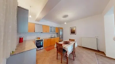 Kitchen; kitchen appliances, tile floor, natural light