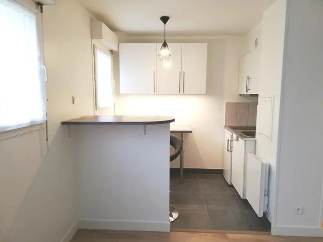 Kitchen; kitchen appliances, tile floor, natural light