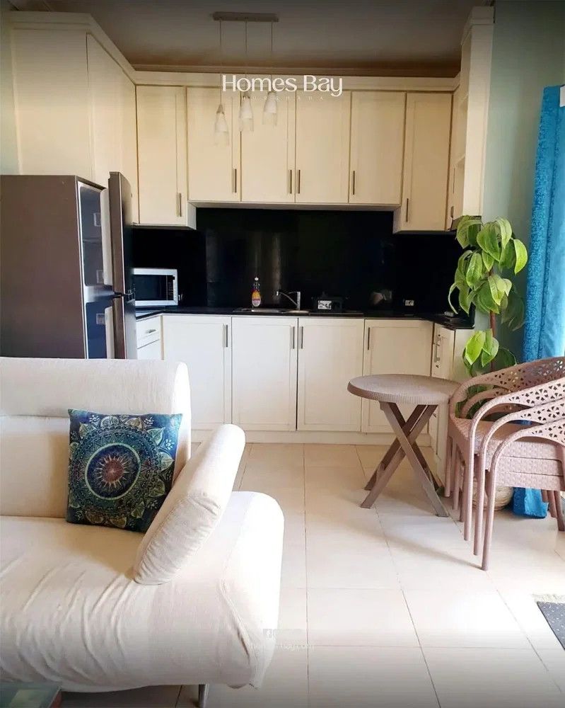 Kitchen; kitchen appliances, tile floor, natural light