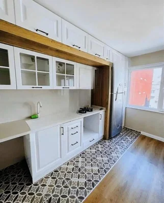 Kitchen; kitchen appliances, tile floor, wood floor, renovated, natural light