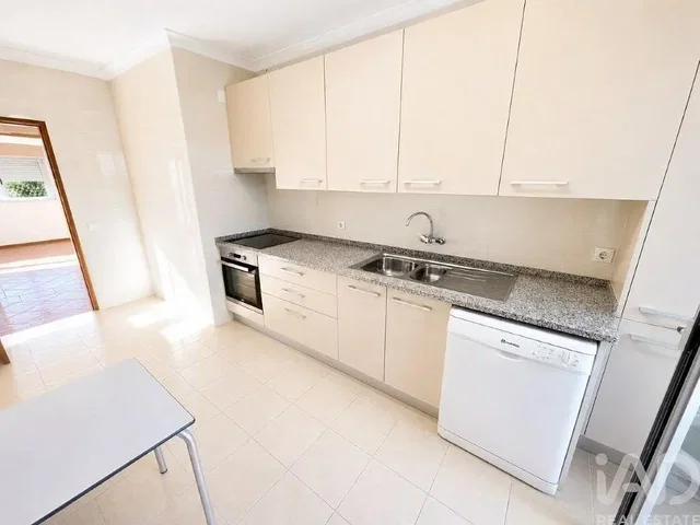 Kitchen; kitchen appliances, tile floor, natural light
