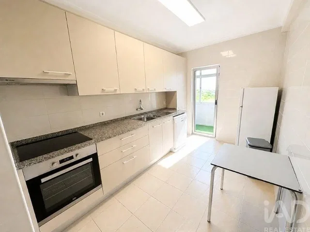Kitchen; kitchen appliances, tile floor, natural light