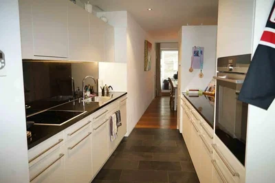 Kitchen; kitchen appliances, tile floor, natural light