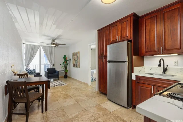 Kitchen; kitchen appliances, tile floor, natural light